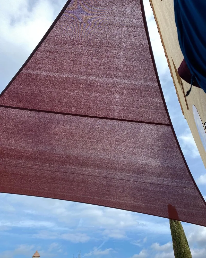 Shade sail seen from below against the sky